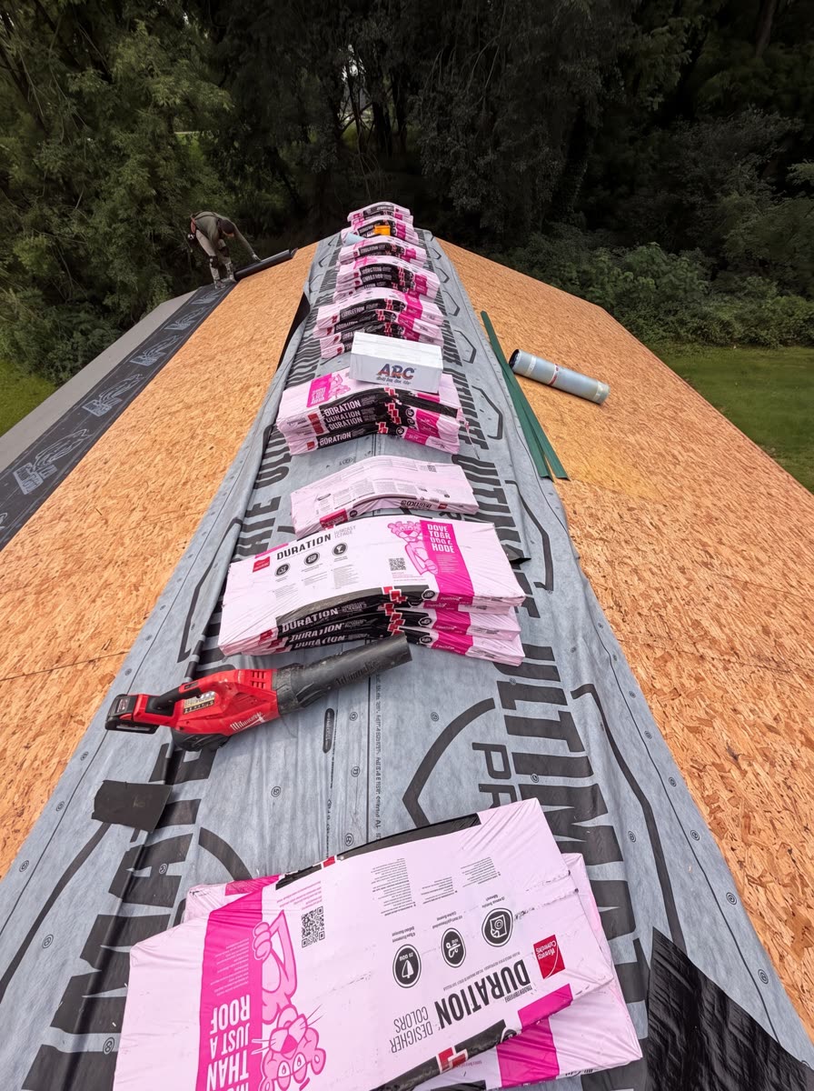 Owens Corning Duration shingle bundles staged on the new roof deck